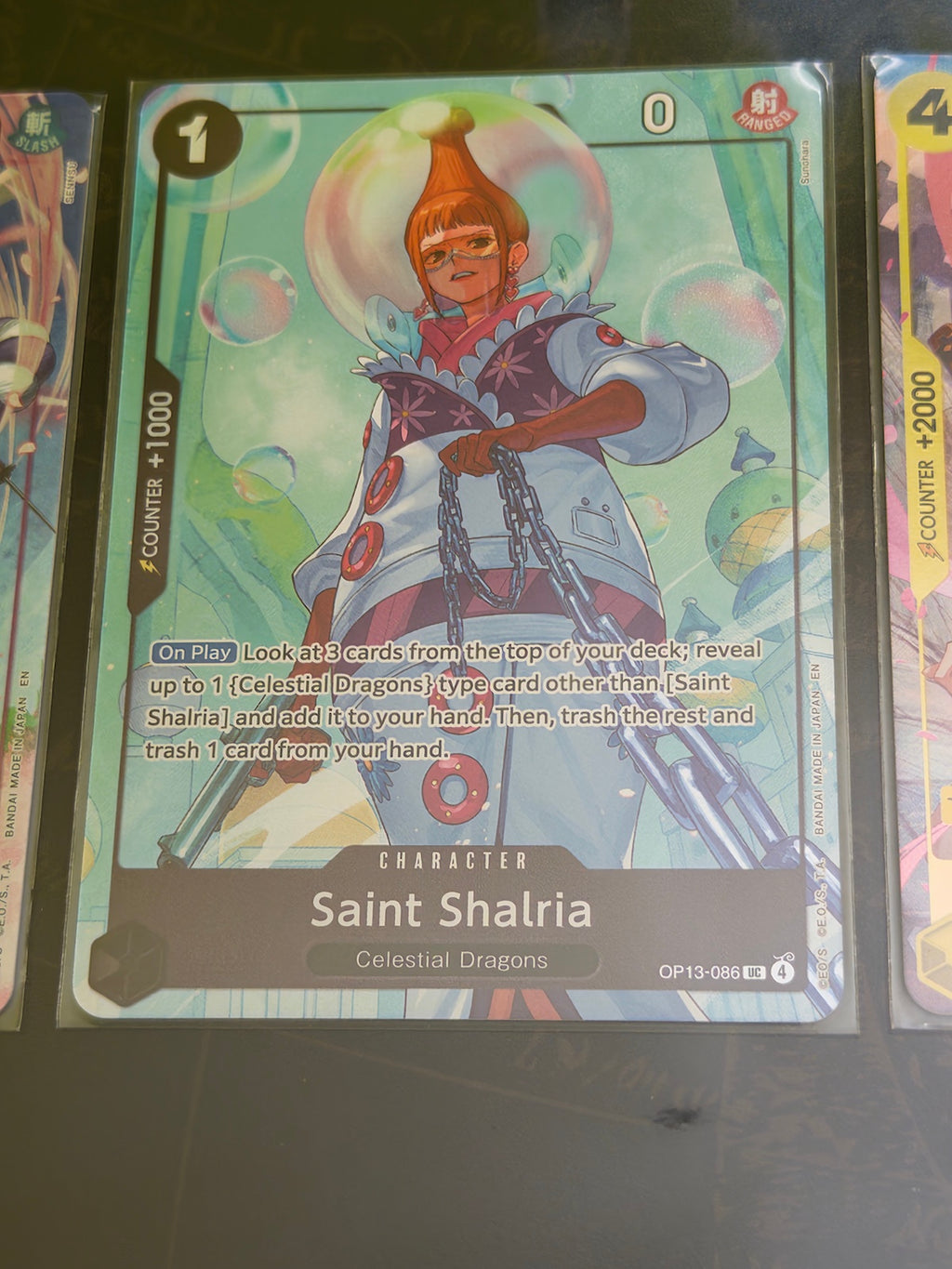 Cartas Saint Shalria y Hina de One Piece Card Game incluidas en Premium Card Collection Best Selection Vol.5.