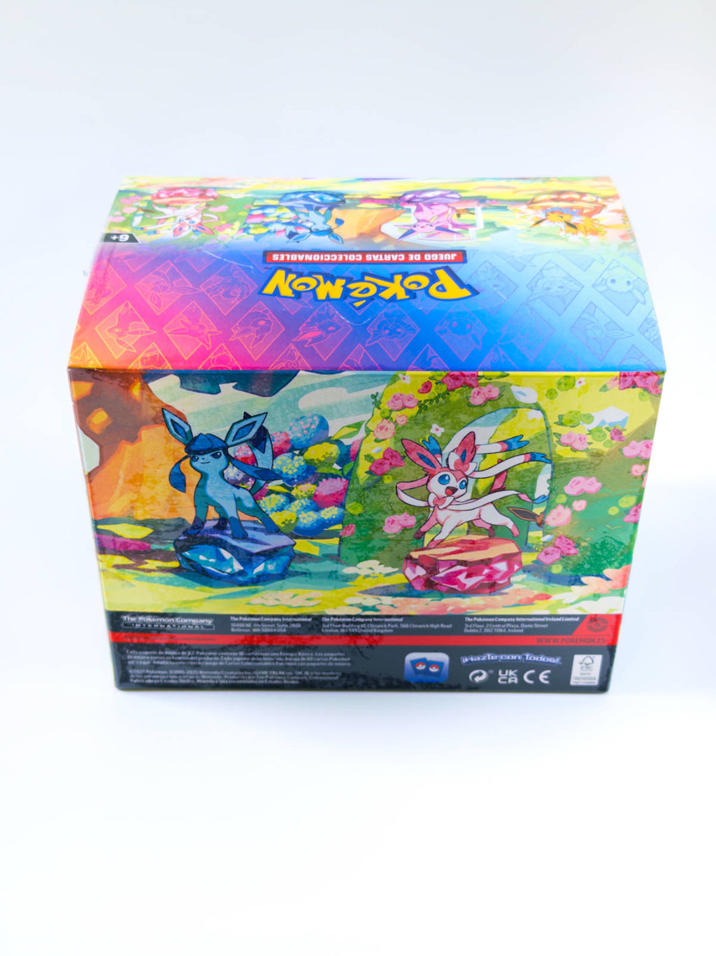 Display de Mini Tins Pokémon Evoluciones Prismáticas en español - vista trasera